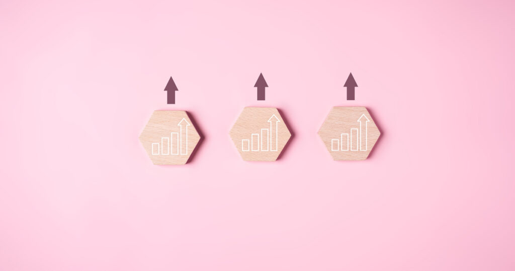 Wooden blocks with upward trend arrows