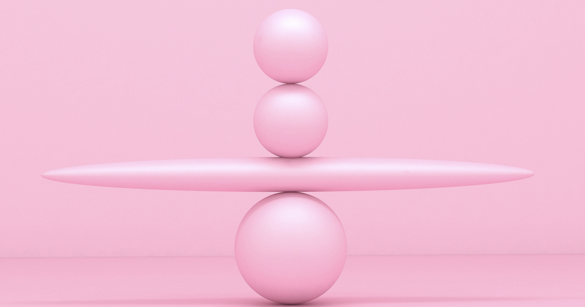 Pink spheres balancing on abstract background