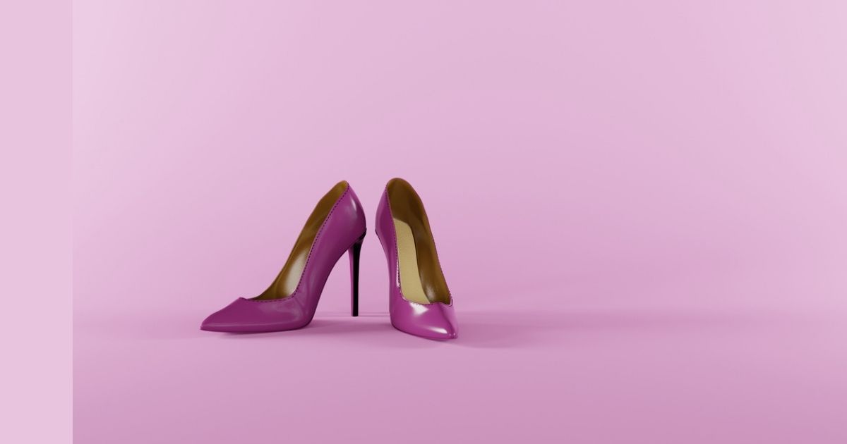 Purple high heels on pink background.