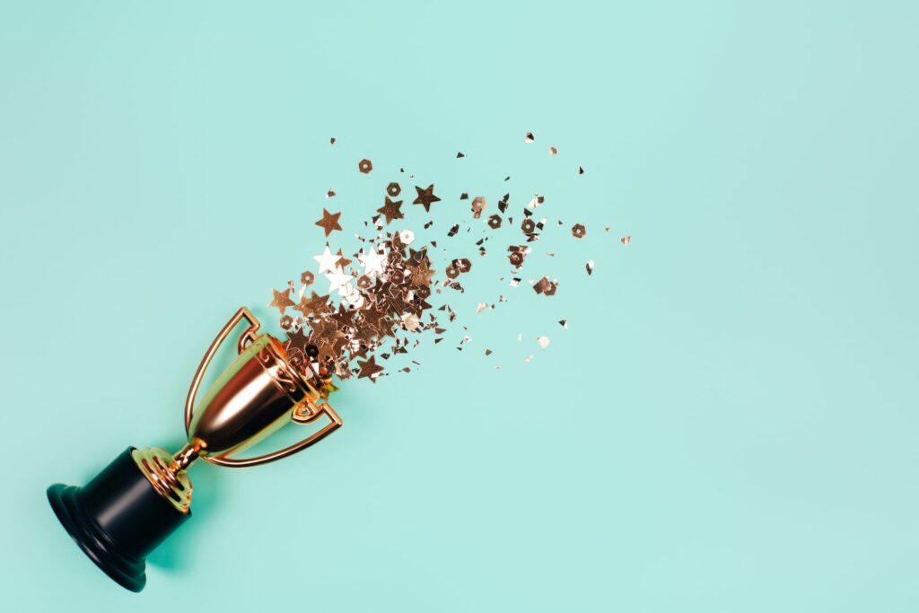 Trophy with stars on turquoise background