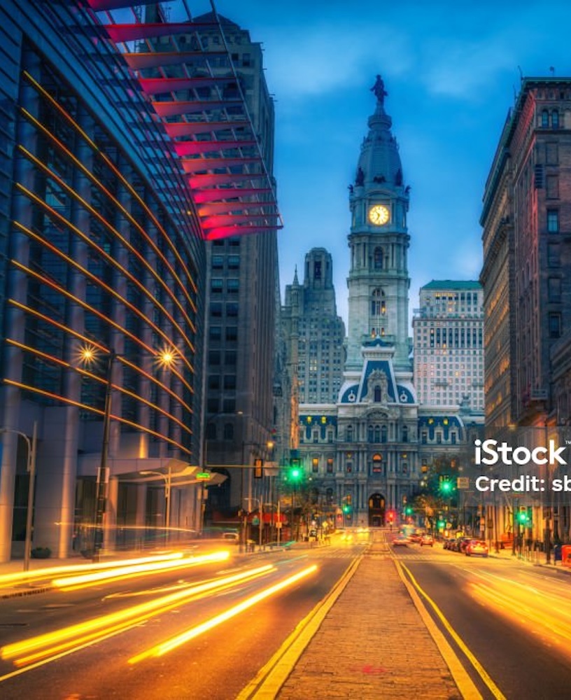 Philadelphia City Hall at night with light trails.